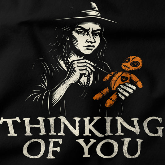 Black and white graphic of a person holding a Voodoo doll with text 'THINKING OF YOU' on a black background.